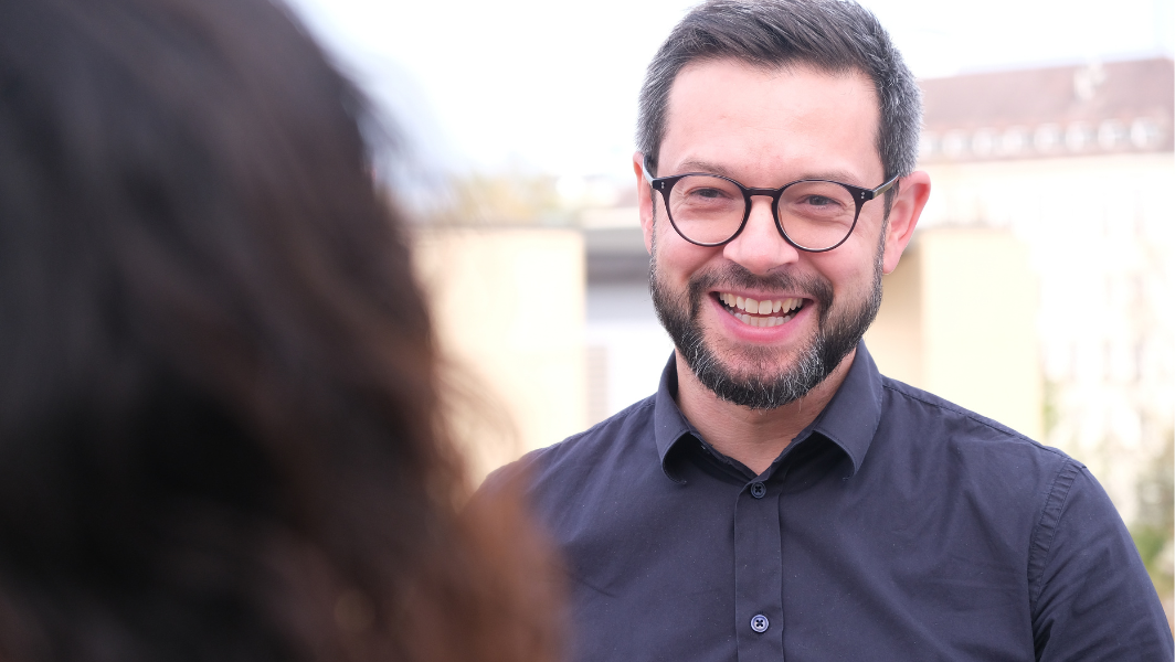 Laughing man with glasses 