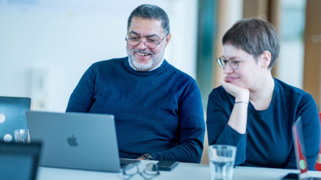 Man and woman , table, laptop